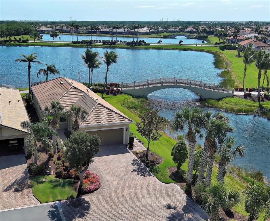 19240 Isadora Street Venice, FL 34293 - Photo 1 of 1 an aerial view of a house with a lake view