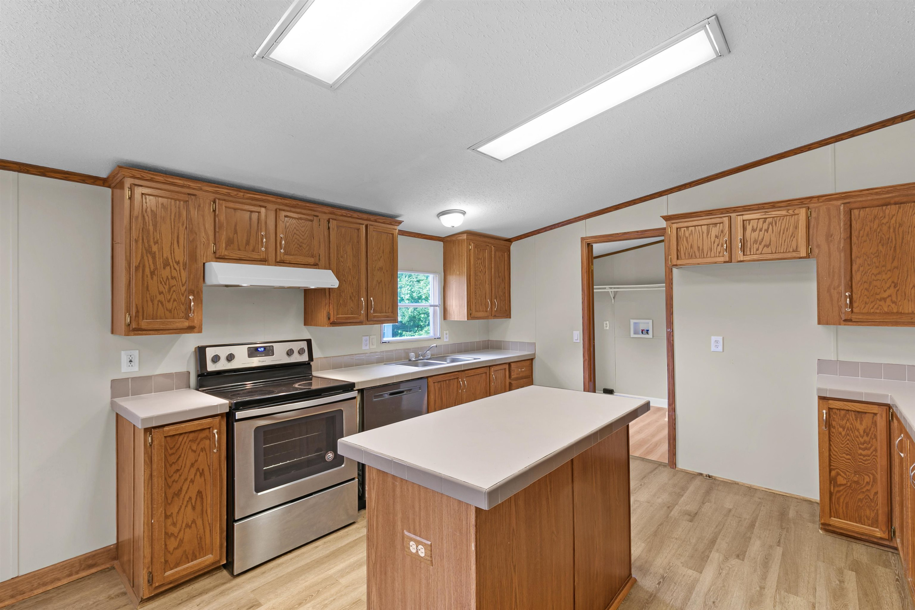 1799 Westover Road Jackson, TN 38301 - Photo 7 of 19 a kitchen with a stove cabinets and wooden floor