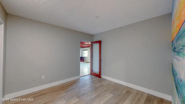 a view of an empty room with a window
