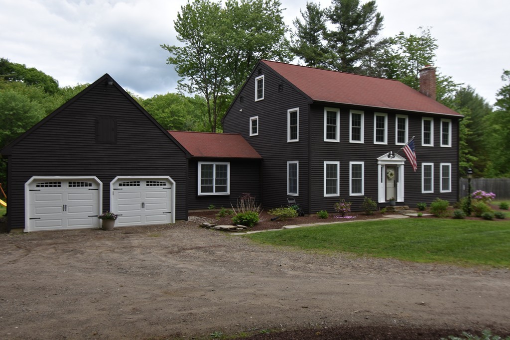 286 Main Road Montgomery, MA 01085 - Photo 1 of 27 a front view of a house with garden