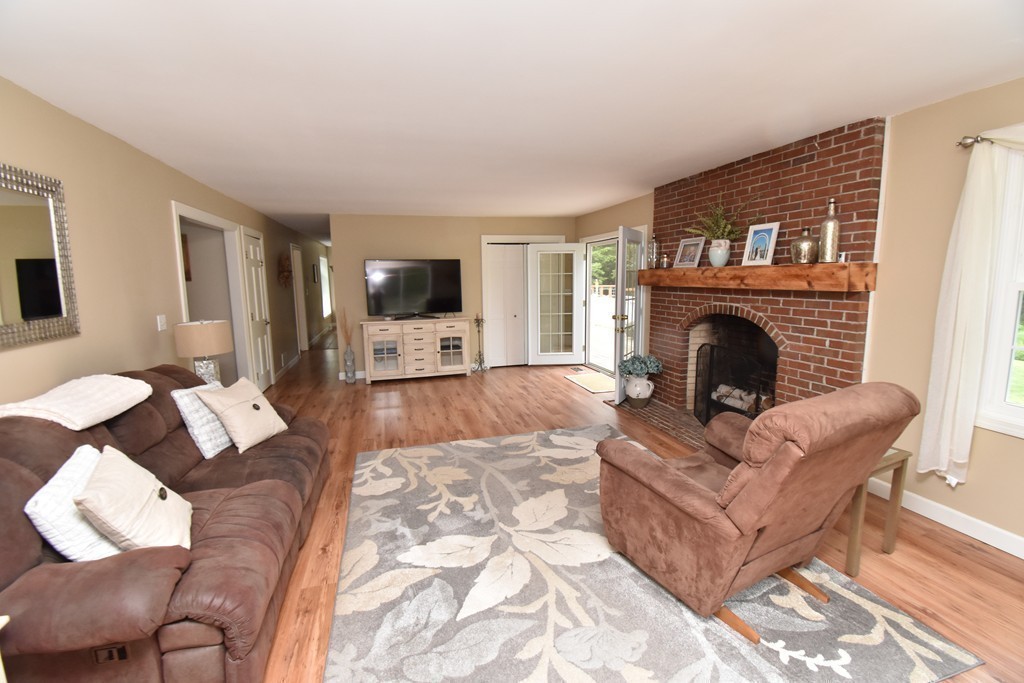 286 Main Road Montgomery, MA 01085 - Photo 11 of 27 a living room with furniture and a fireplace