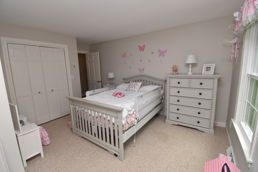 286 Main Road Montgomery, MA 01085 - Photo 18 of 27 a bedroom that has a bed and a baby in it