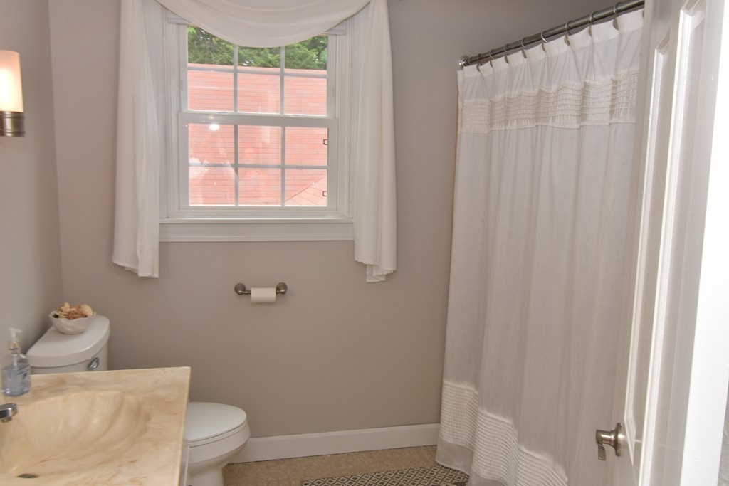 286 Main Road Montgomery, MA 01085 - Photo 19 of 27 a bathroom with a toilet and a shower curtain