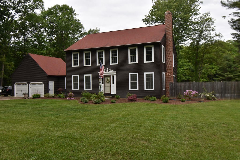286 Main Road Montgomery, MA 01085 - Photo 2 of 27 a front view of a house with a garden
