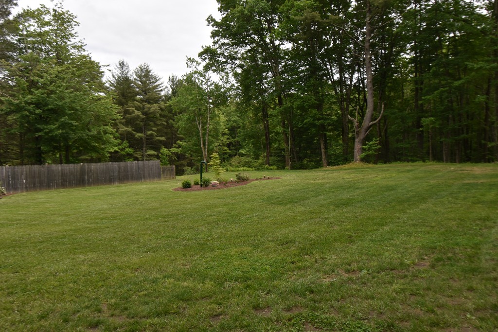 286 Main Road Montgomery, MA 01085 - Photo 27 of 27 a backyard of a house with lots of green space