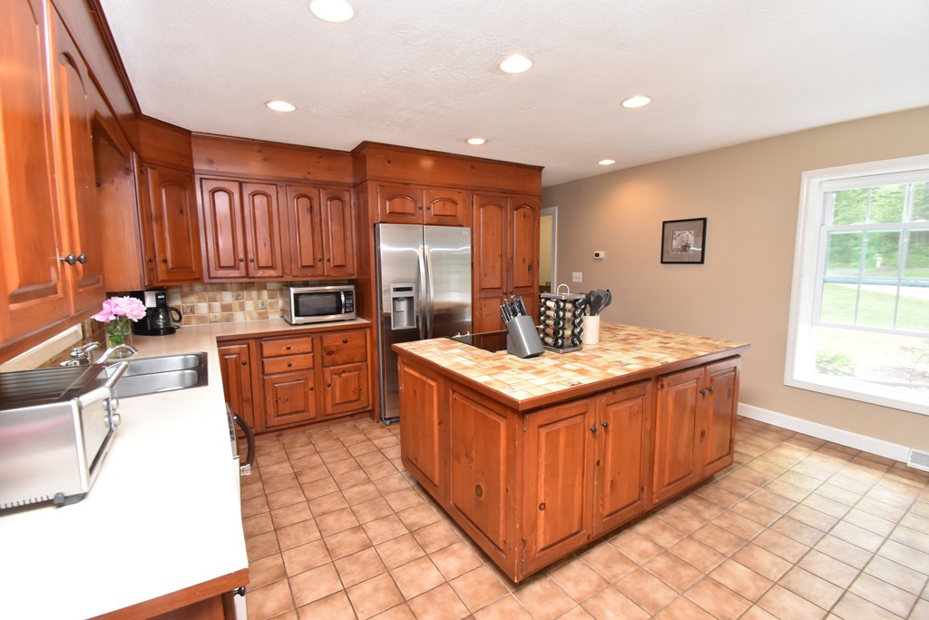 286 Main Road Montgomery, MA 01085 - Photo 4 of 27 a kitchen with a sink stove and cabinets
