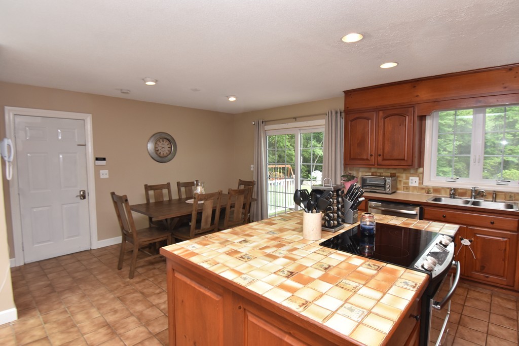 286 Main Road Montgomery, MA 01085 - Photo 5 of 27 a kitchen with a sink and chairs