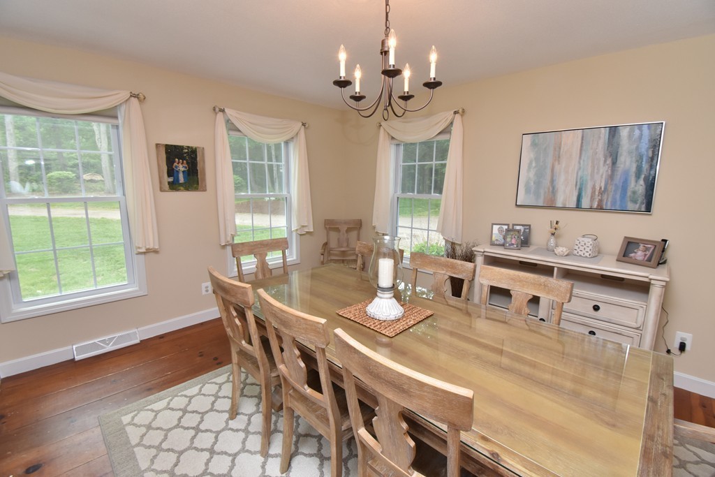 286 Main Road Montgomery, MA 01085 - Photo 7 of 27 a view of a dining room with furniture wooden floor and chandelier