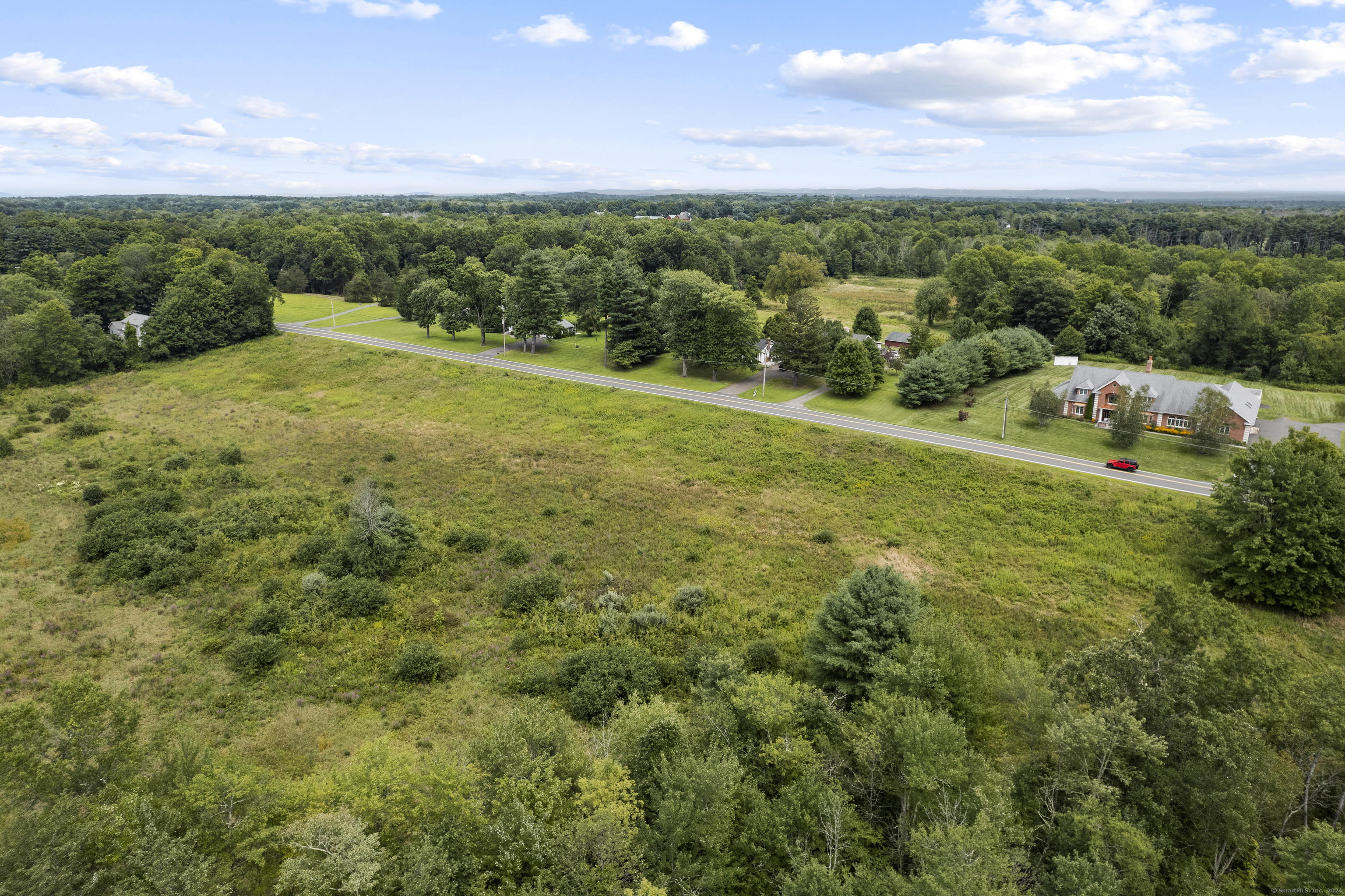 South Stone Street Suffield, CT 06078 - Photo 13 of 15 a view of a green field with lots of trees in it
