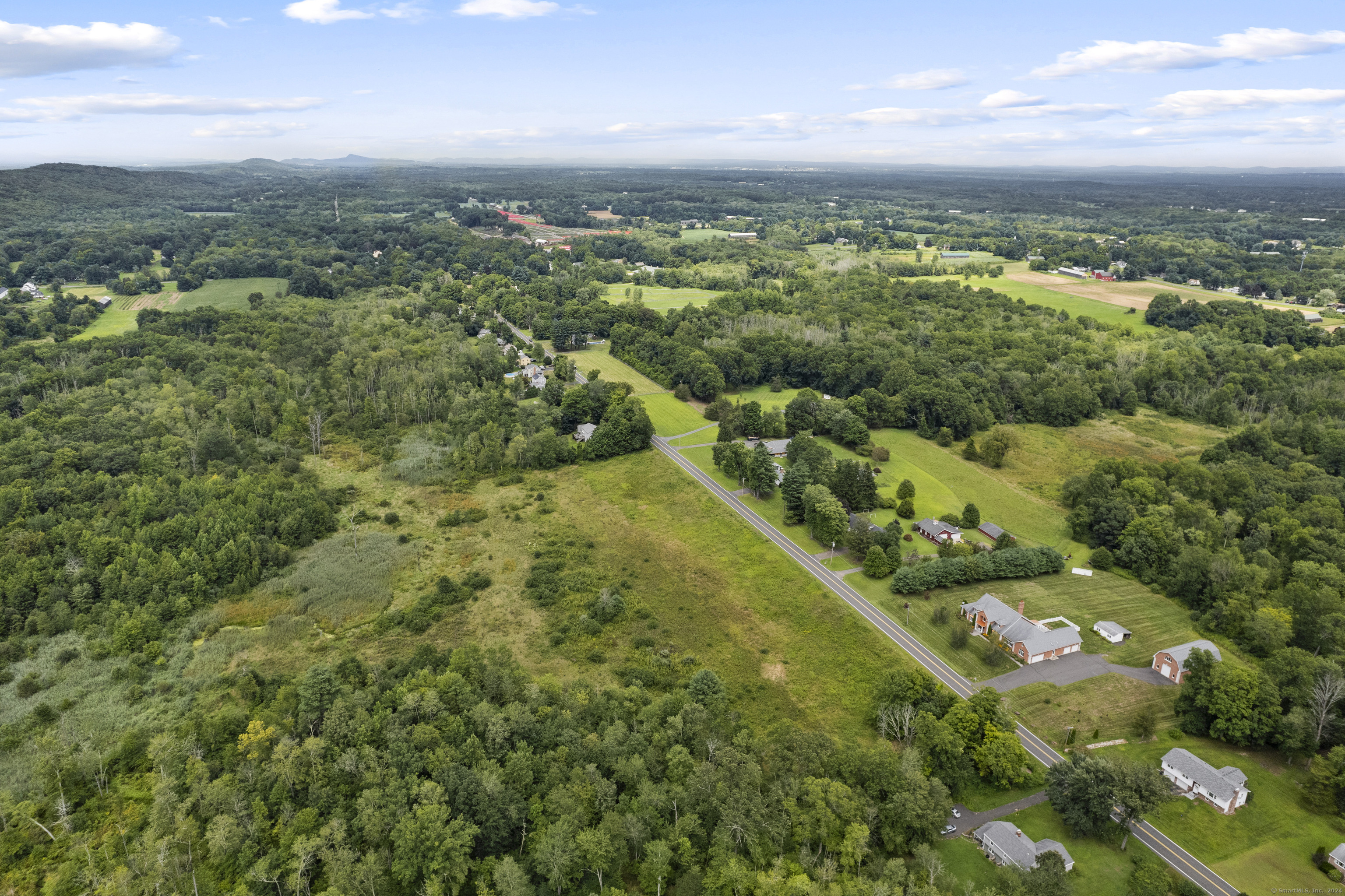 South Stone Street Suffield, CT 06078 - Photo 2 of 15 an aerial view of residential houses with outdoor space and trees