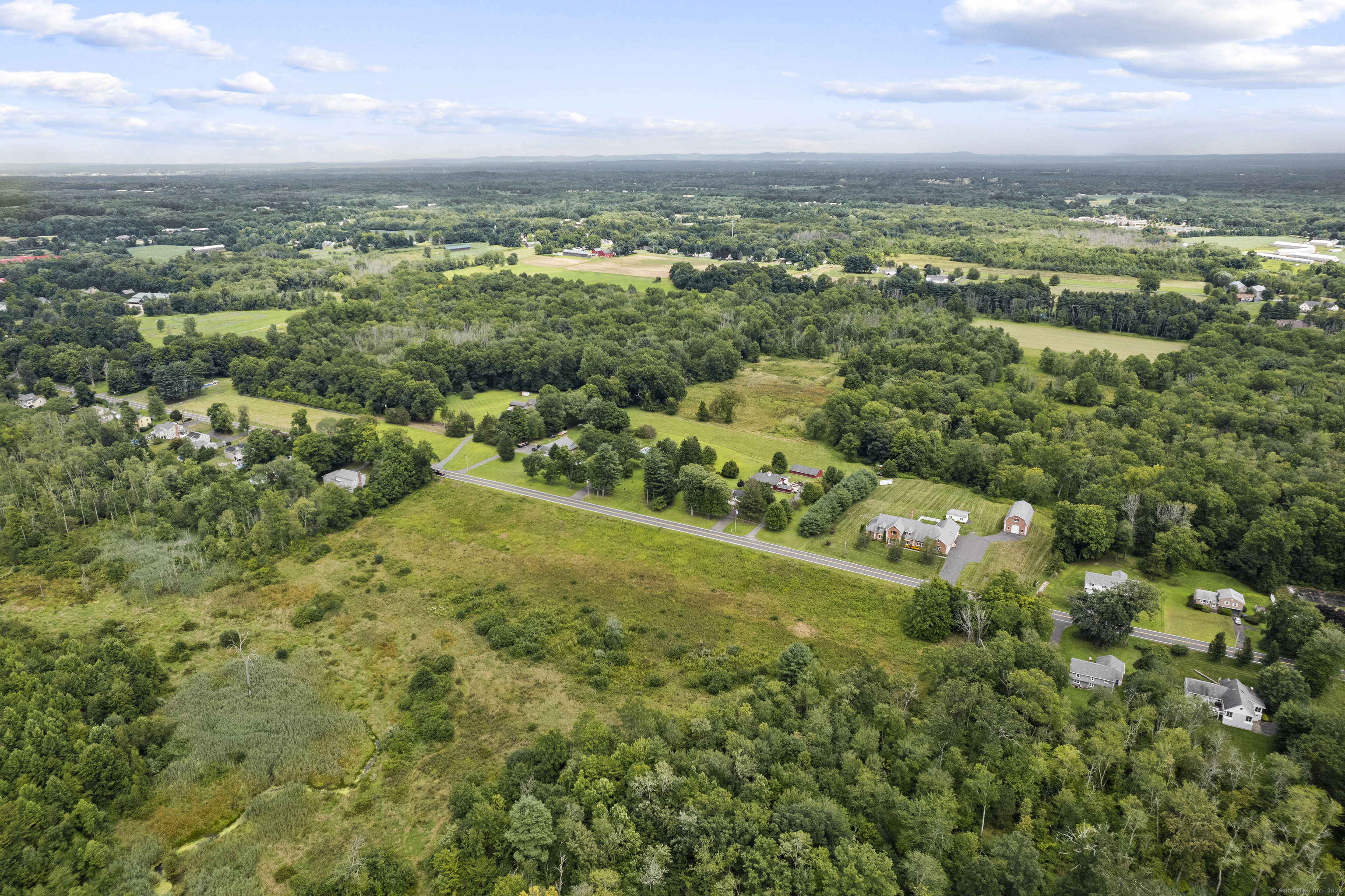 South Stone Street Suffield, CT 06078 - Photo 3 of 15 an aerial view of residential houses with outdoor space and trees