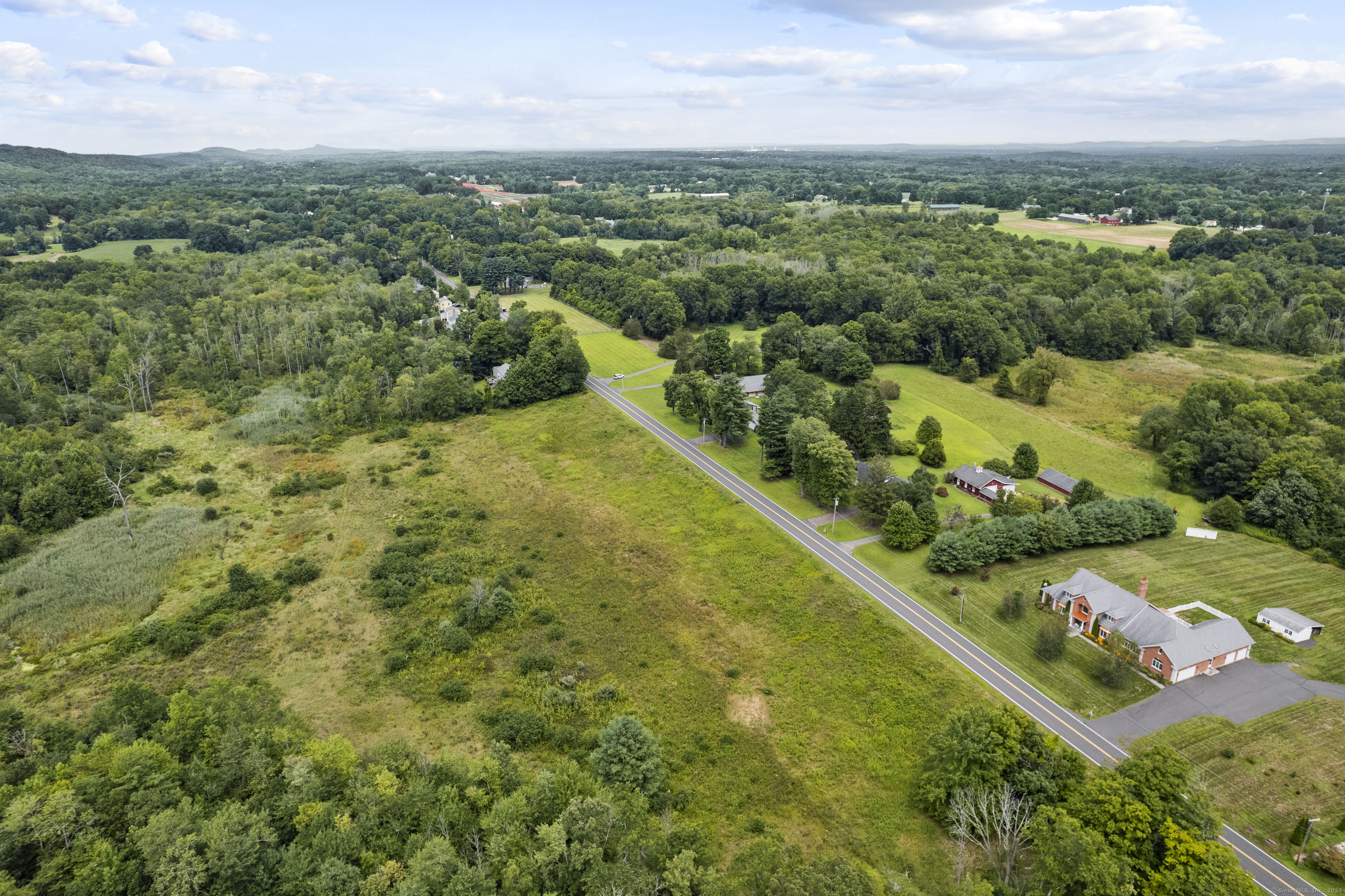 South Stone Street Suffield, CT 06078 - Photo 8 of 15 an aerial view of residential houses with outdoor space and trees