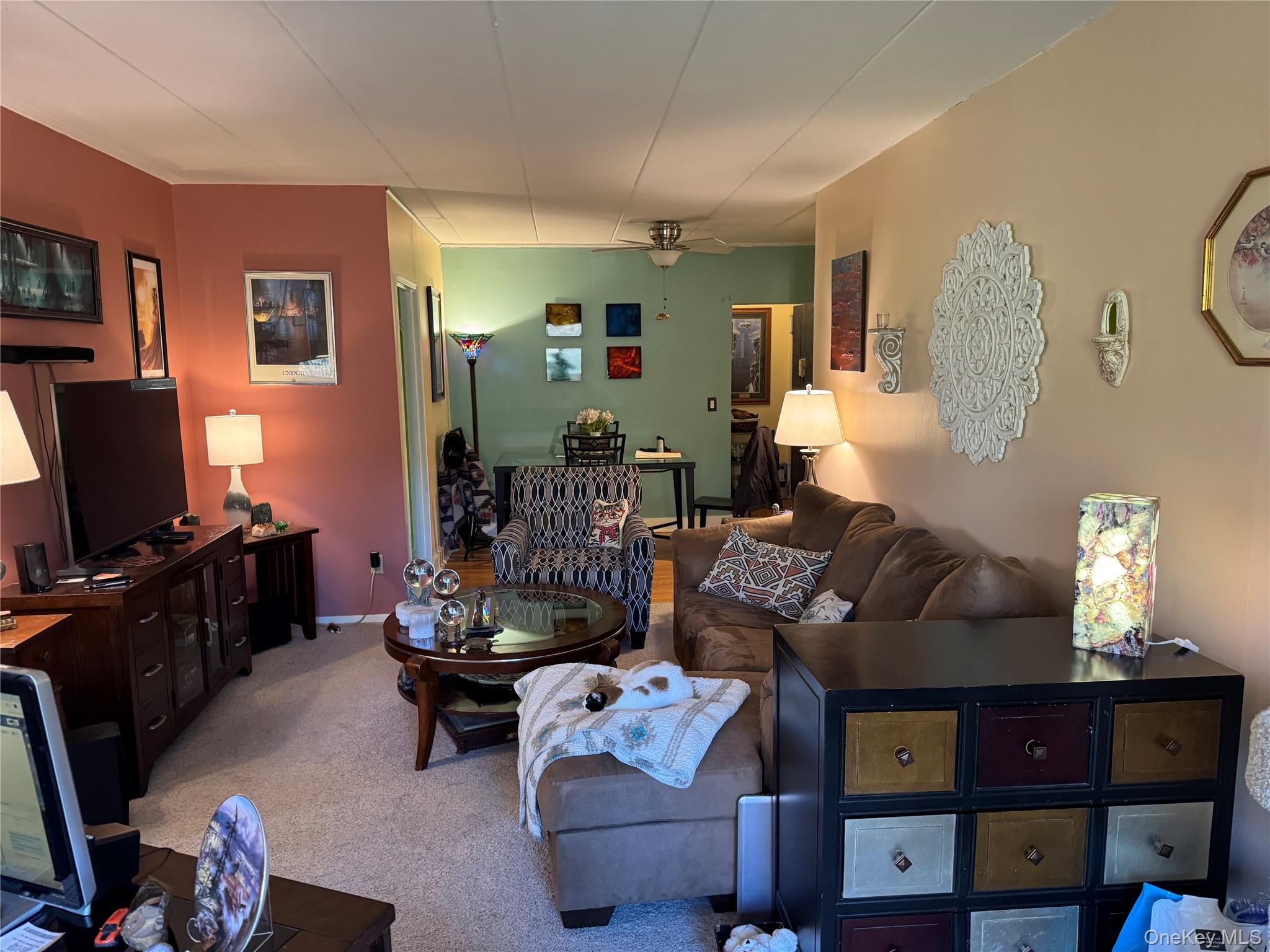 1101 Midland Avenue, Unit 402 Bronxville, NY 10708 - Photo 12 of 20 a living room with furniture and a flat screen tv