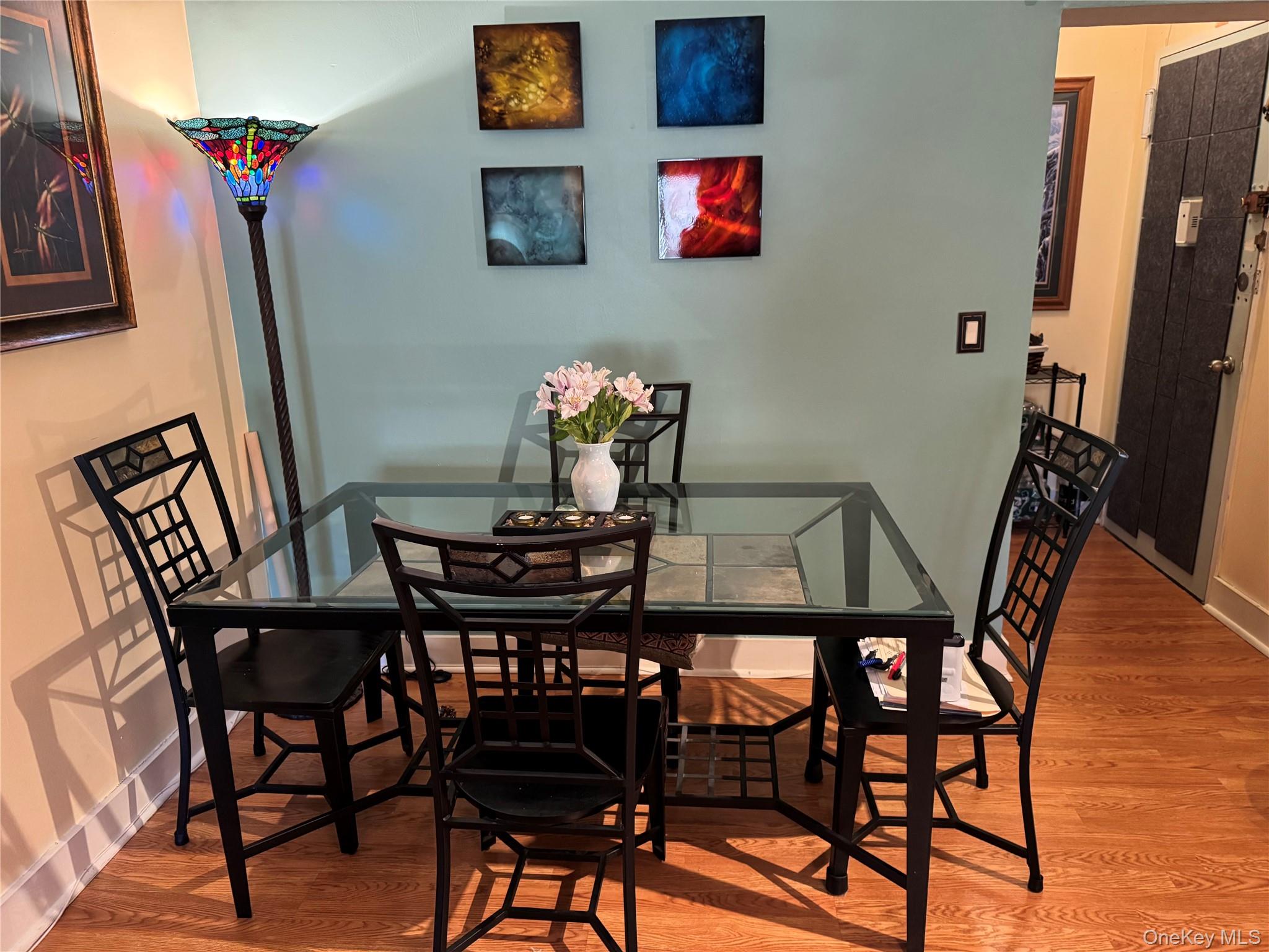 1101 Midland Avenue, Unit 402 Bronxville, NY 10708 - Photo 13 of 20 a view of a dining room with furniture and wooden floor