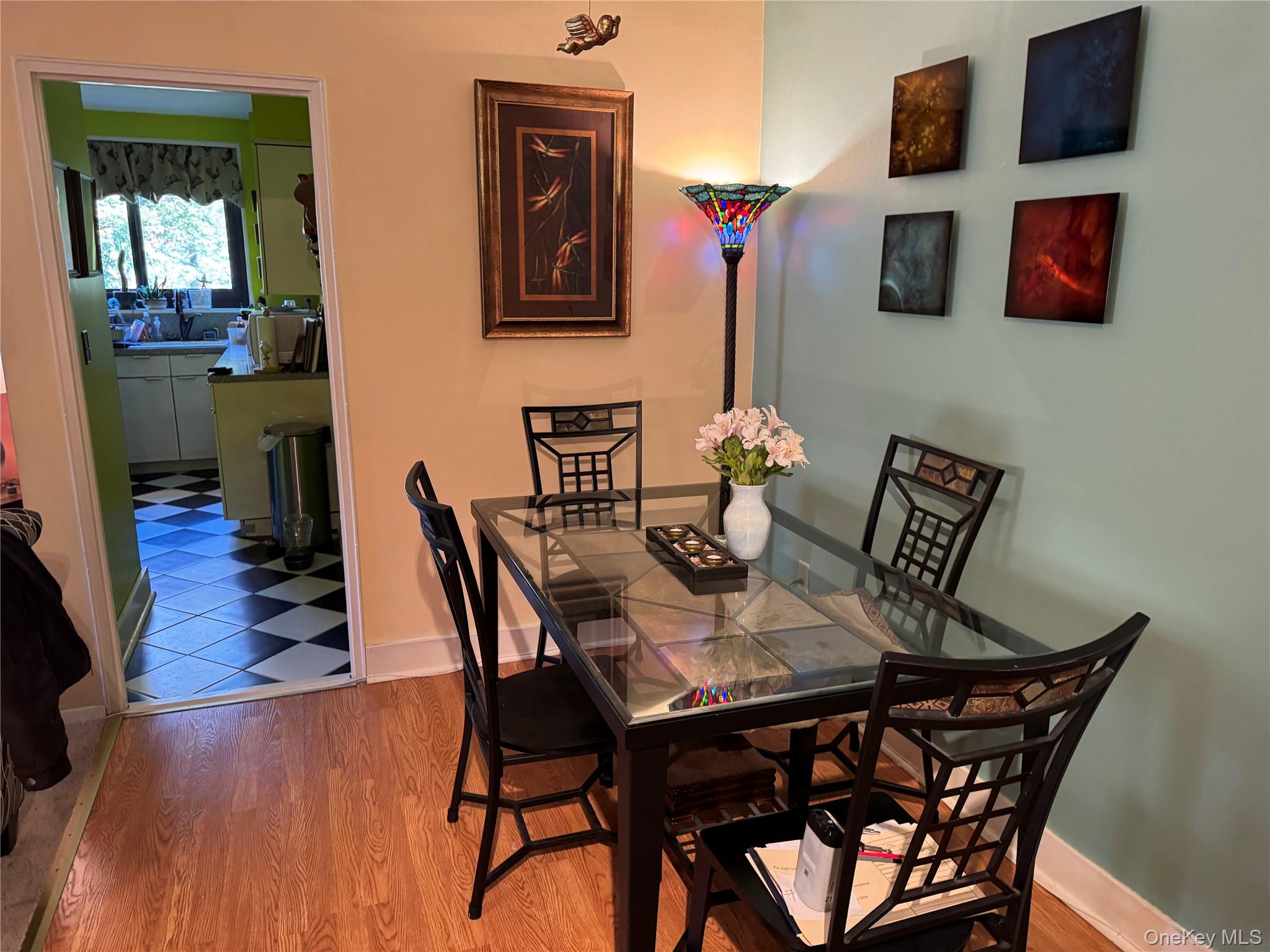 1101 Midland Avenue, Unit 402 Bronxville, NY 10708 - Photo 14 of 20 a view of a dining room with furniture and wooden floor