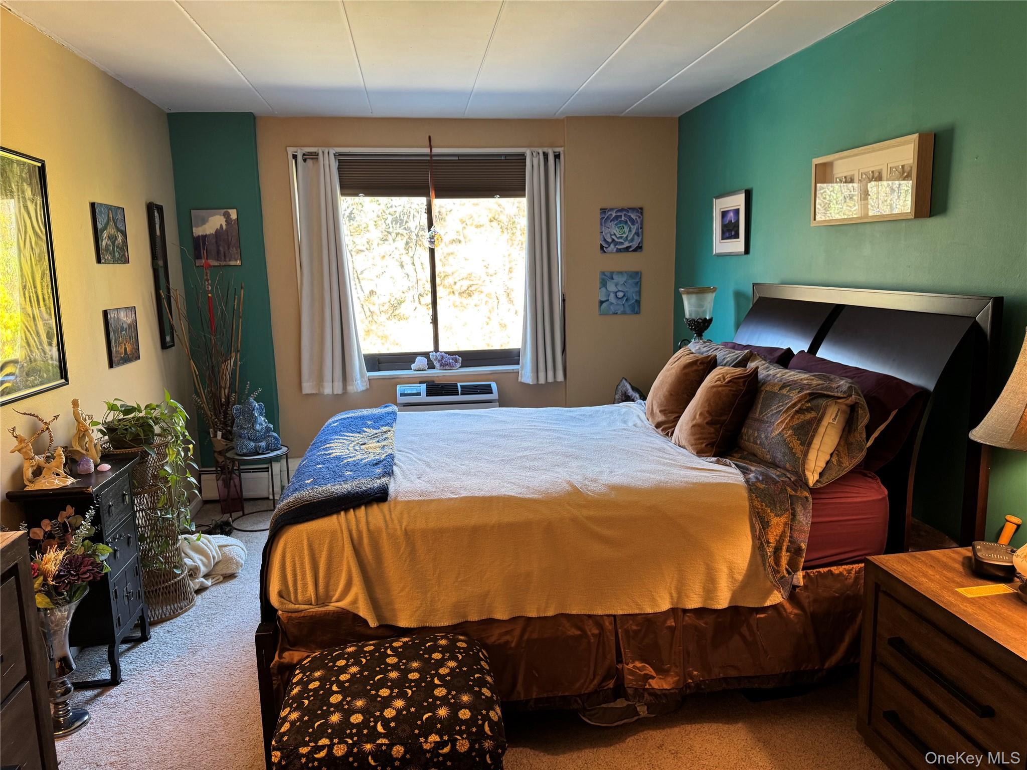1101 Midland Avenue, Unit 402 Bronxville, NY 10708 - Photo 15 of 20 a bedroom with furniture and a window
