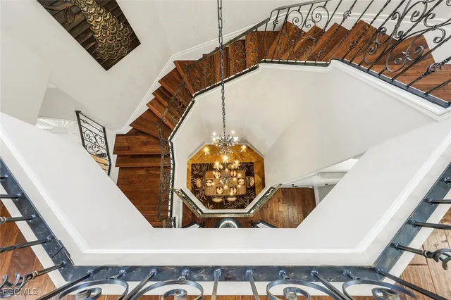 a bed room with furniture and a chandelier
