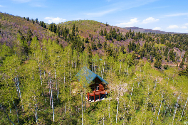 2096 South Aspen Ridge Coalville, UT 84017 - Photo 3 of 44 Wood-sided cabin nestled among mature deciduous and evergreen trees