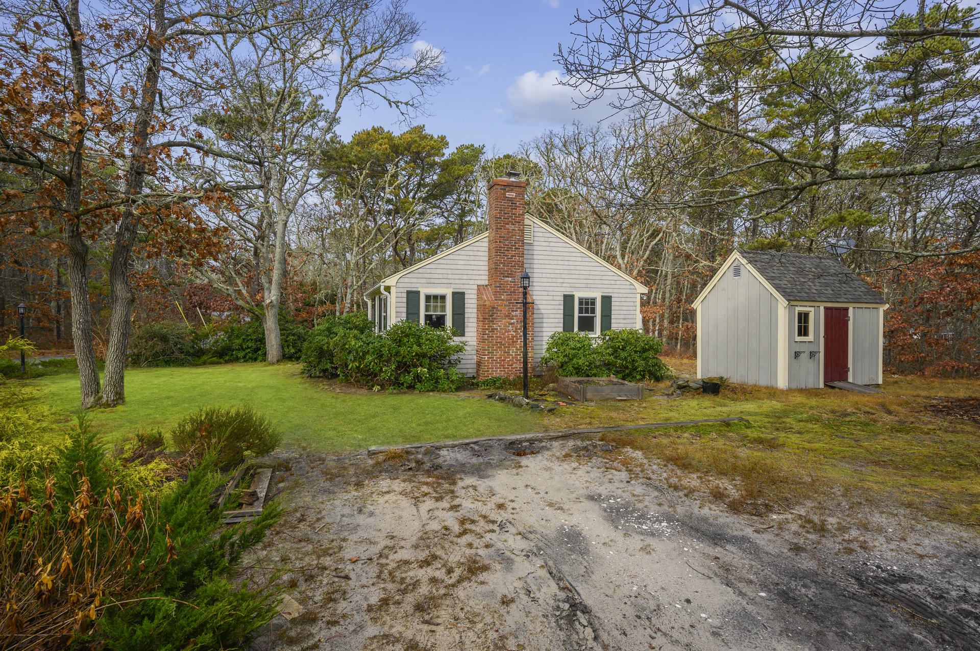 289 Cahoon Hollow Road Wellfleet, MA 02667 - Photo 17 of 25 a front view of house with yard and green space