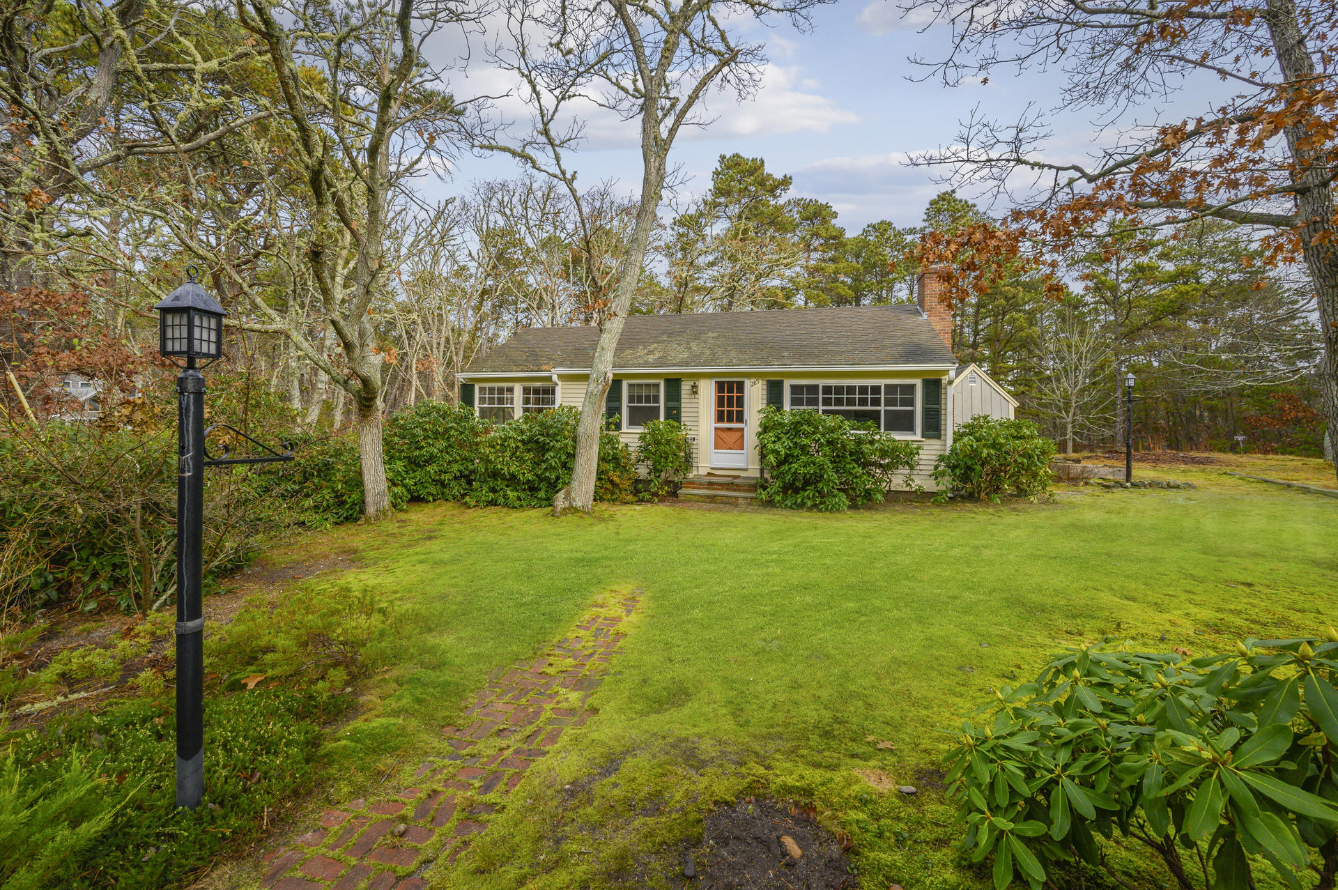 289 Cahoon Hollow Road Wellfleet, MA 02667 - Photo 2 of 25 front view of house with a yard