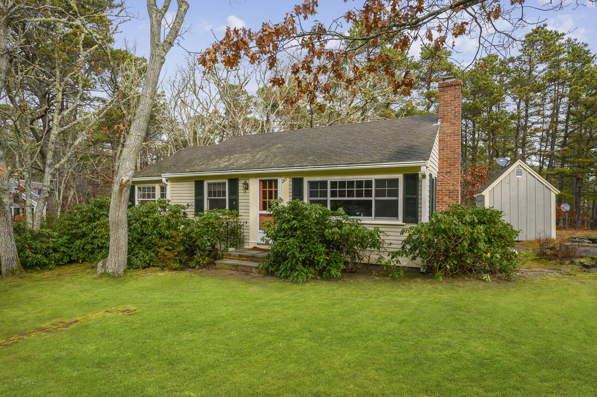 289 Cahoon Hollow Road Wellfleet, MA 02667 - Photo 3 of 25 a front view of house with yard and green space