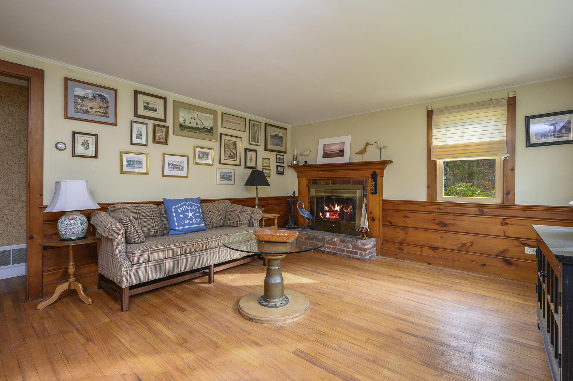 289 Cahoon Hollow Road Wellfleet, MA 02667 - Photo 5 of 25 a living room with furniture and a fireplace