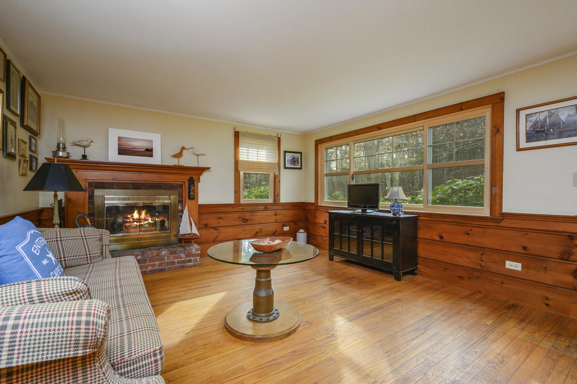 289 Cahoon Hollow Road Wellfleet, MA 02667 - Photo 7 of 25 a living room with furniture and a fireplace
