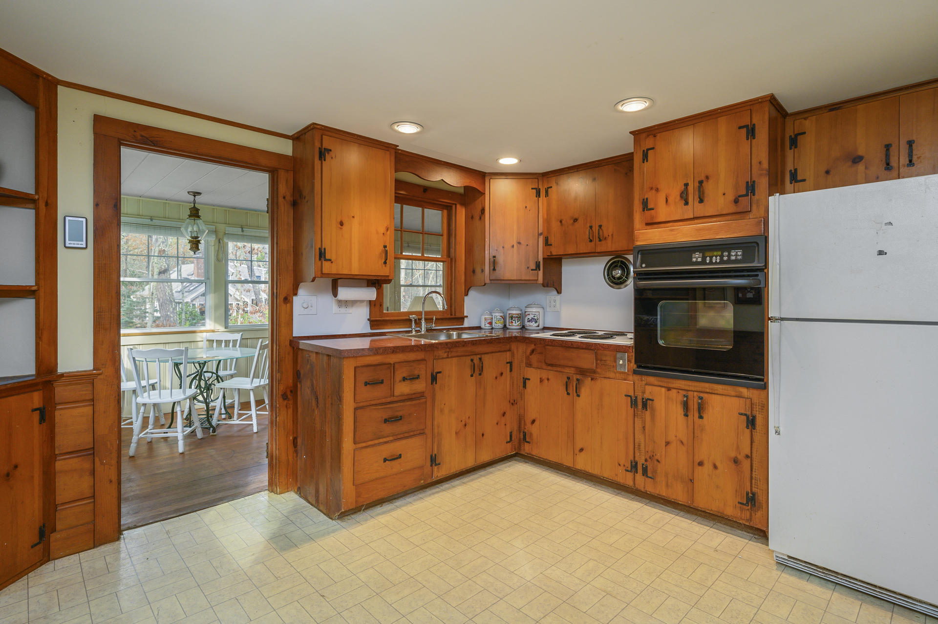289 Cahoon Hollow Road Wellfleet, MA 02667 - Photo 8 of 25 a kitchen with stainless steel appliances granite countertop a stove top oven a sink and a refrigerator