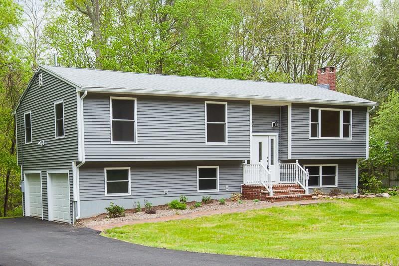 21 Beaver Pond Road Madison, CT 06443 - Photo 1 of 1 a front view of a house with patio