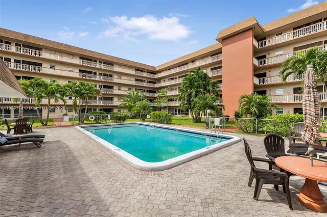 a view of a swimming pool with a patio