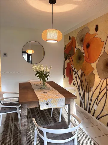 a dining room with furniture and window