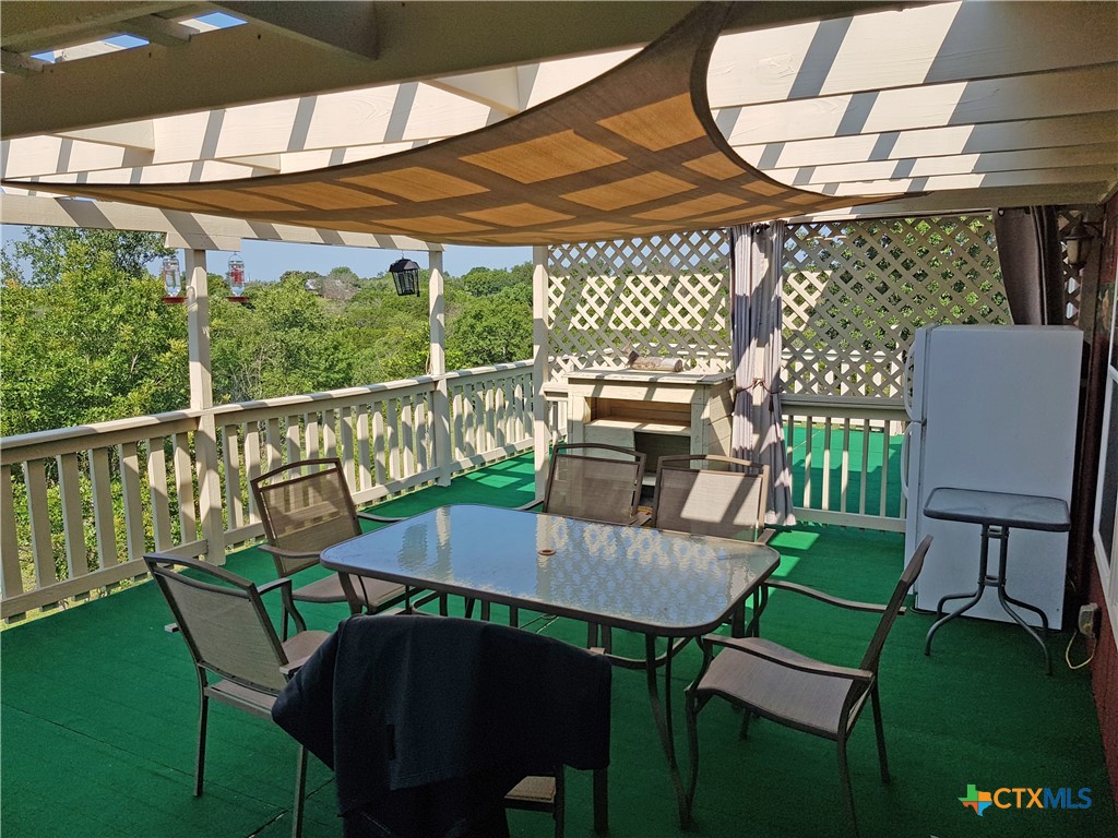 935 County Road 4820 Kempner, TX 76539 - Photo 13 of 48 a view of a balcony with table and chairs