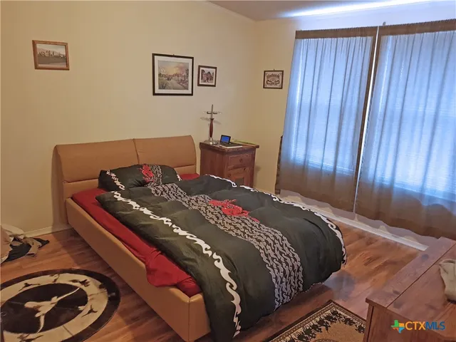 a bedroom with a bed and a closet
