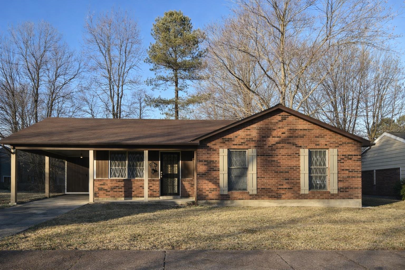 3300 Keystone Avenue Memphis, TN 38128 - Photo 1 of 18 a front view of a house with a yard and garage