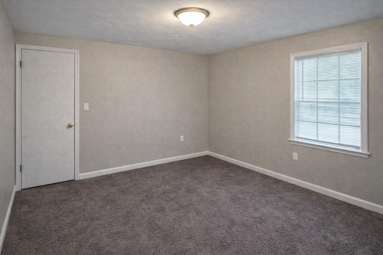 3300 Keystone Avenue Memphis, TN 38128 - Photo 12 of 18 Unfurnished room with dark colored carpet and a textured ceiling