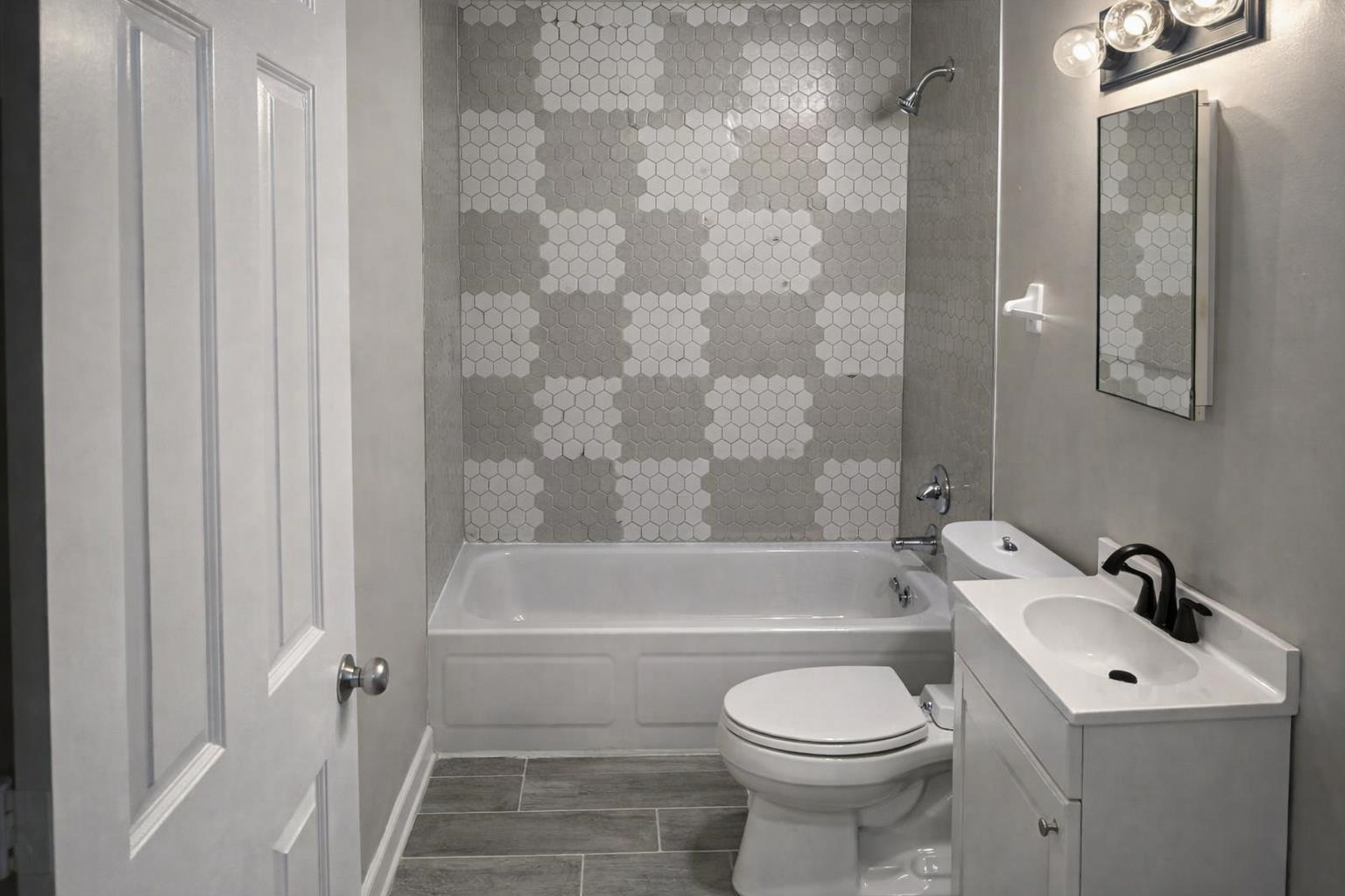 3300 Keystone Avenue Memphis, TN 38128 - Photo 4 of 18 a bathroom with a sink toilet and shower
