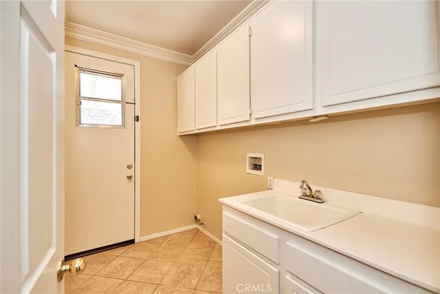 a bathroom with a sink and a window