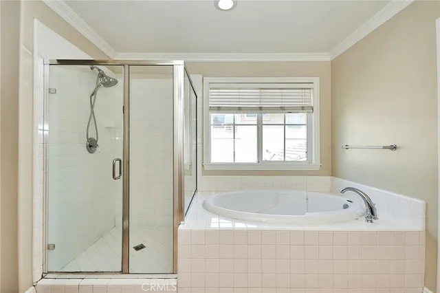 a bathroom with a bathtub and shower