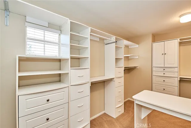 a room with cabinets and a window