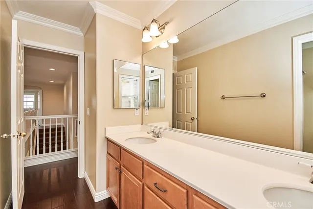 a bathroom with a sink a vanity and a mirror