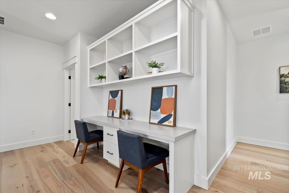 11379 West Helenium Drive Star, ID 83669 - Photo 26 of 50 Home office with light wood-style flooring and recessed lighting