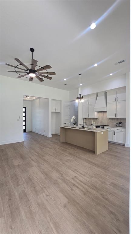 1106 East Sixth Street Springtown, TX 76082 - Photo 12 of 29 a view of kitchen with kitchen island white cabinets and stainless steel appliances