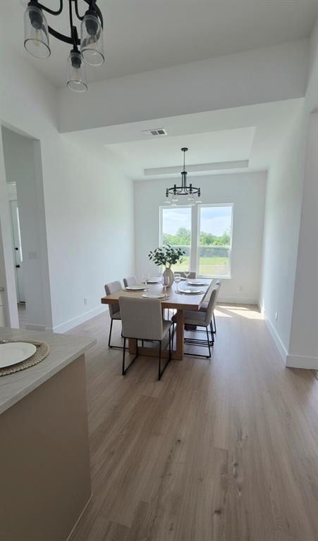 1106 East Sixth Street Springtown, TX 76082 - Photo 14 of 29 a view of a dining room with furniture and window