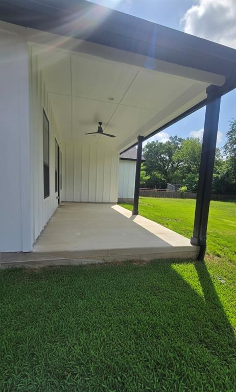 1106 East Sixth Street Springtown, TX 76082 - Photo 26 of 29 a view of an empty room with yard and a floor to ceiling window