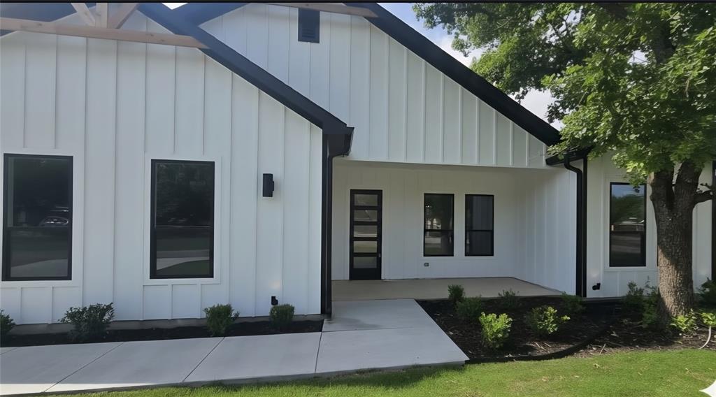 1106 East Sixth Street Springtown, TX 76082 - Photo 3 of 29 a front view of a house with a yard