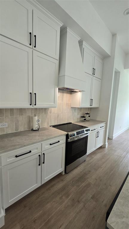 1106 East Sixth Street Springtown, TX 76082 - Photo 5 of 29 a large kitchen with stainless steel appliances granite countertop a stove and a sink