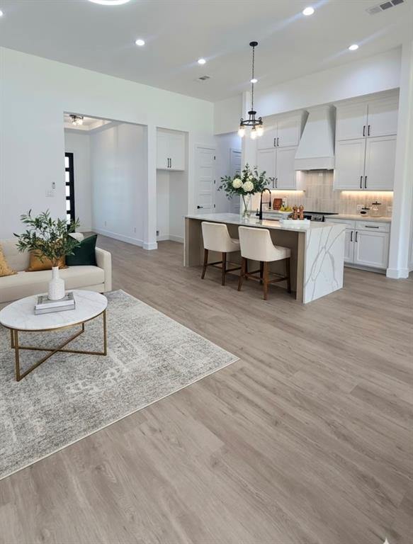 1106 East Sixth Street Springtown, TX 76082 - Photo 9 of 29 a living room with stainless steel appliances kitchen island granite countertop furniture and a kitchen view