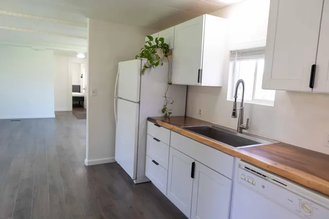 a kitchen with sink and cabinets