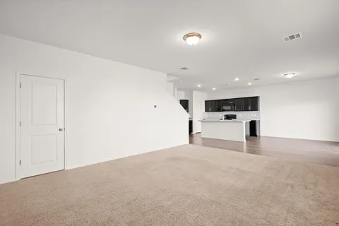 a view of a workspace with furniture and wooden floor
