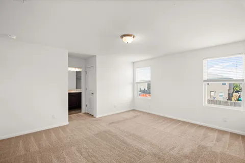 a kitchen with a sink and wooden floor